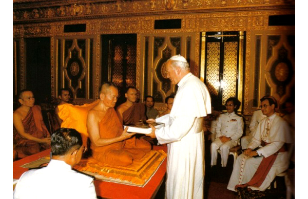 John Paul II paying homage to the Buddhist high priest in Thailand
